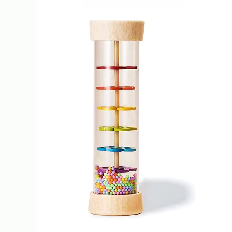 Colorful cylindrical toy with wooden top and base on a white background
