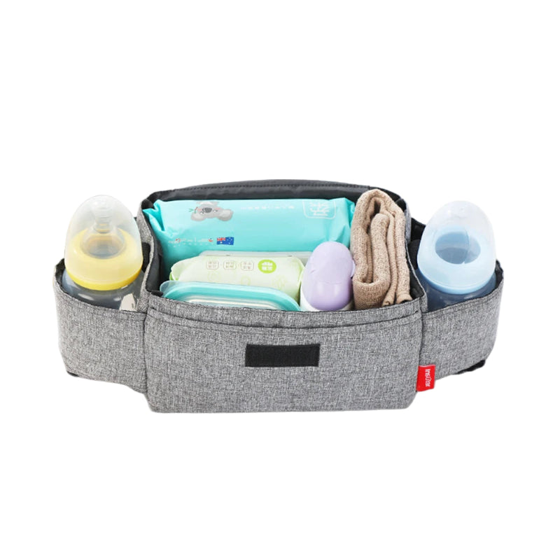 Gray diaper bag with baby items on a white background