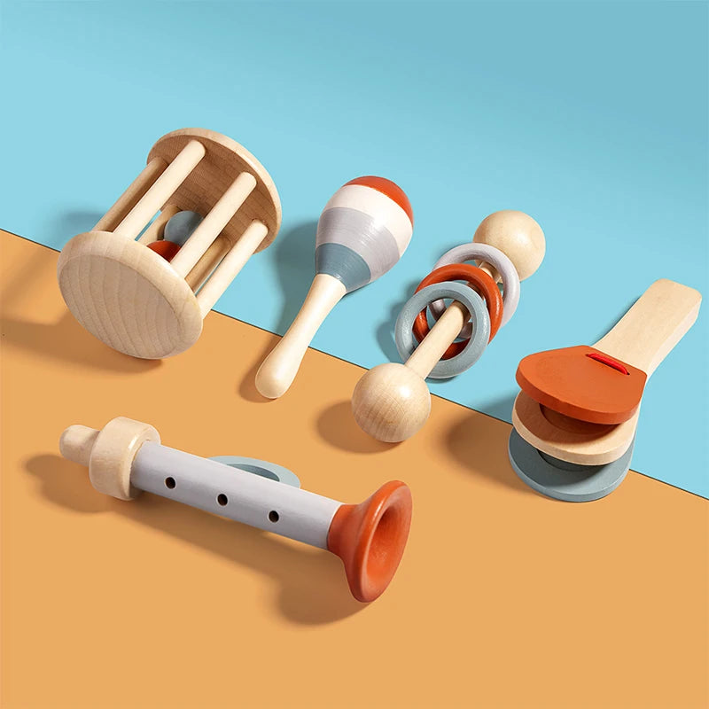 Set of wooden baby toys on a two-tone background