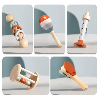 Set of wooden toys including a rattle, maraca, flute, and other items on a light background