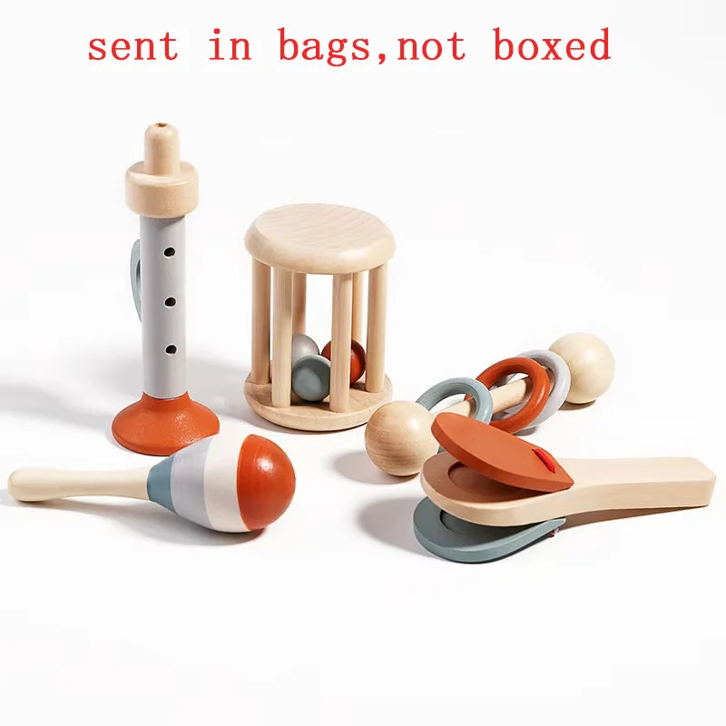 Set of wooden baby toys on a white background with text 'sent in bags, not boxed'.