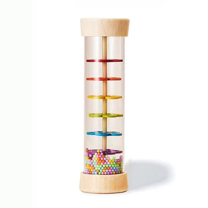 Colorful cylindrical toy with wooden top and base on a white background