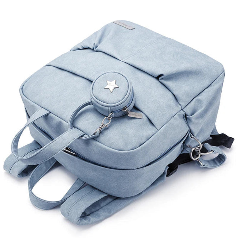 Light blue backpack with a star charm on a white background