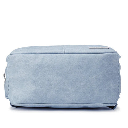 Light blue fabric ottoman on a white background