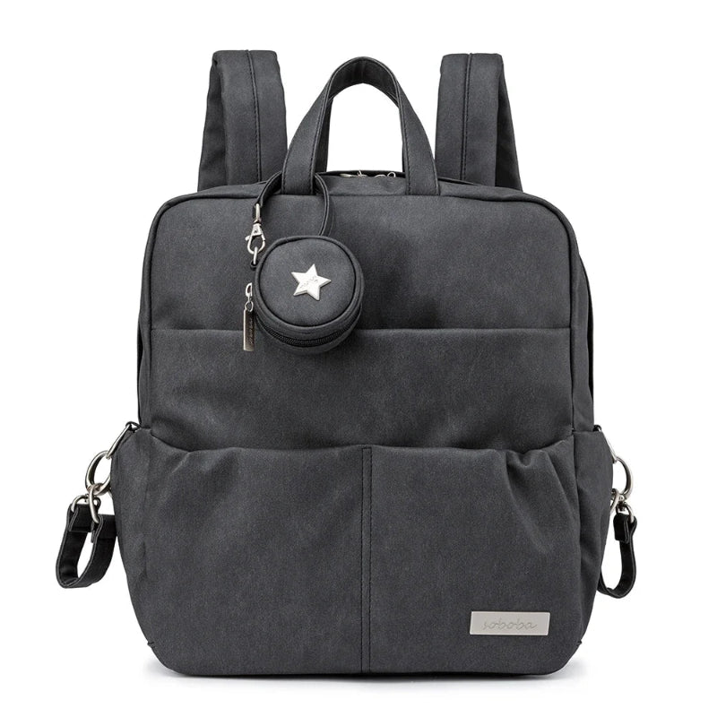 Black backpack with a matching round pouch featuring a star design on a white background