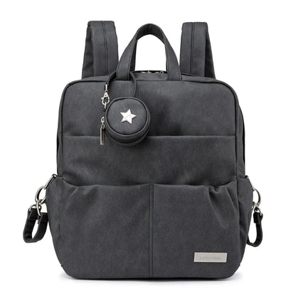 Black backpack with a matching round pouch featuring a star design on a white background