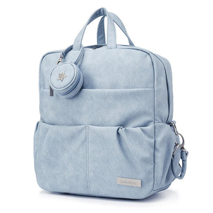 Light blue backpack with a small round pouch on a white background