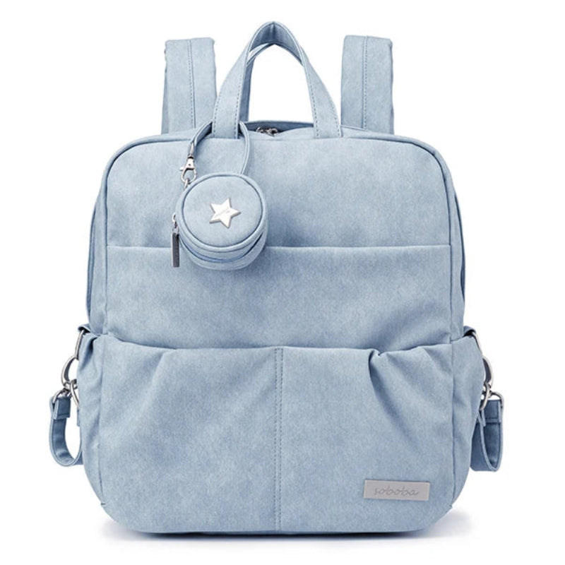Light blue backpack with a star-shaped emblem on a white background