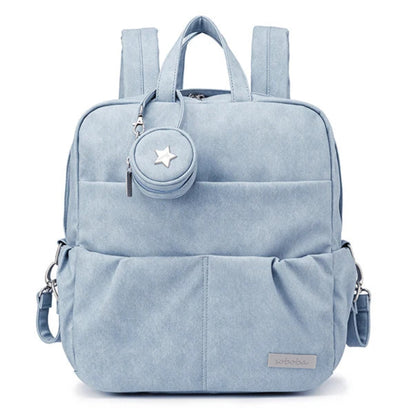 Light blue backpack with a star-shaped emblem on a white background