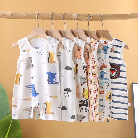 Set of children's sleeveless shirts with various patterns on a wooden rack against a yellow background.