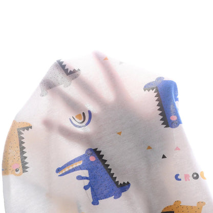 Baby blanket with crocodile pattern on a white background