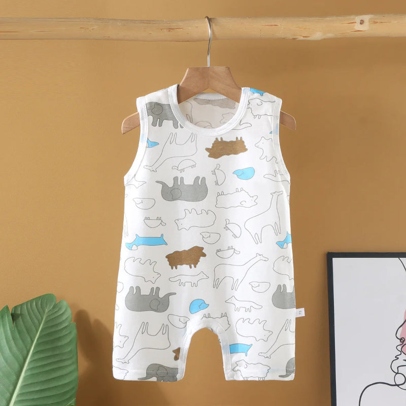 Children's sleeveless romper with animal pattern on a hanger against a mustard yellow wall.
