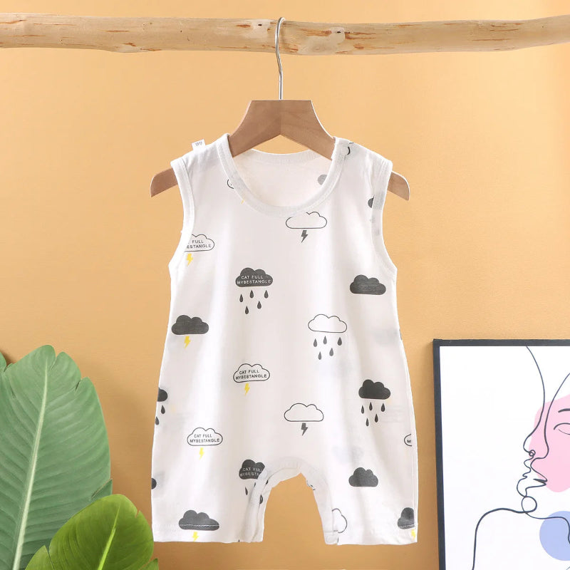 Baby romper with cloud and raindrop patterns on a hanger against a beige wall.