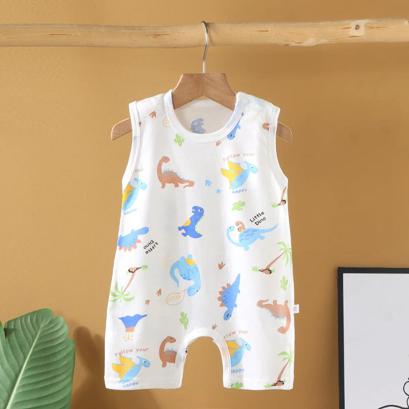 Baby romper with dinosaur pattern on a hanger against a yellow wall