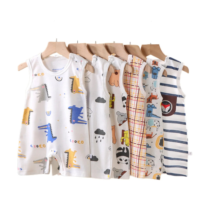 Set of baby rompers with various patterns on hangers against a white background