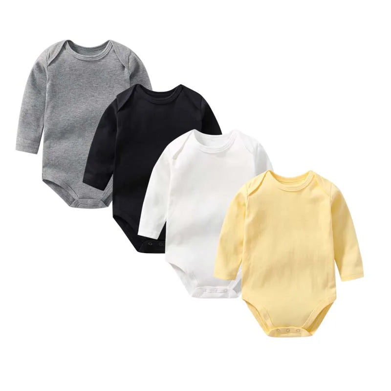 Four baby bodysuits in gray, black, white, and yellow on a white background