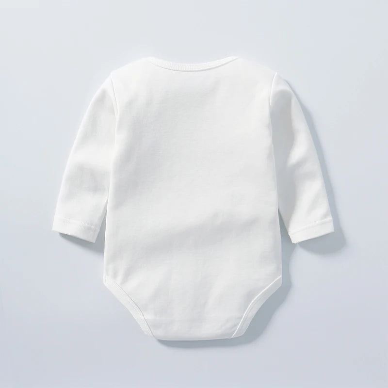 White baby bodysuit with long sleeves on a light gray background