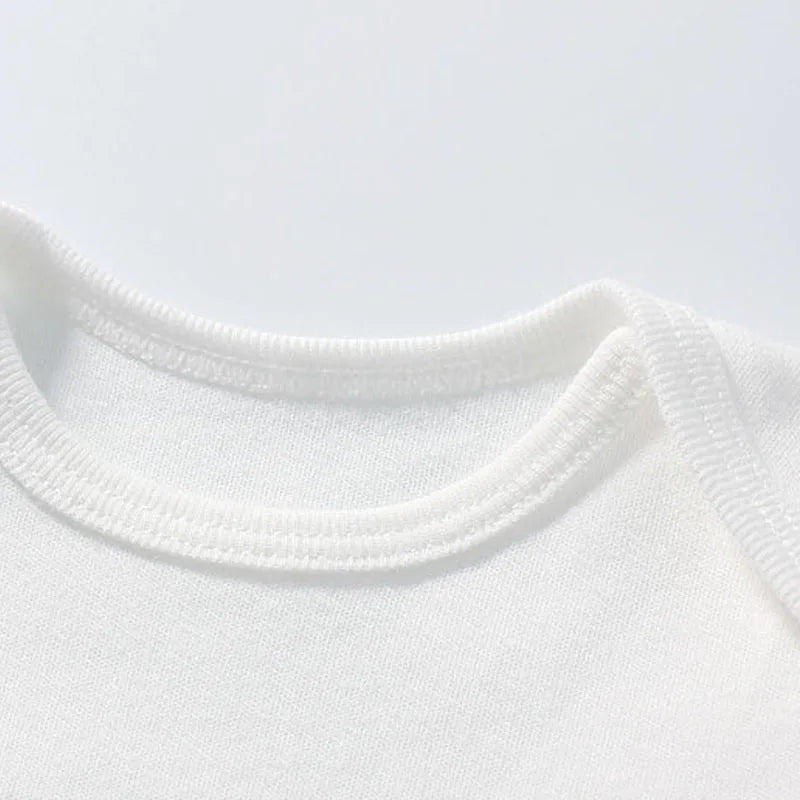 Close-up of a white sweater collar on a light gray background