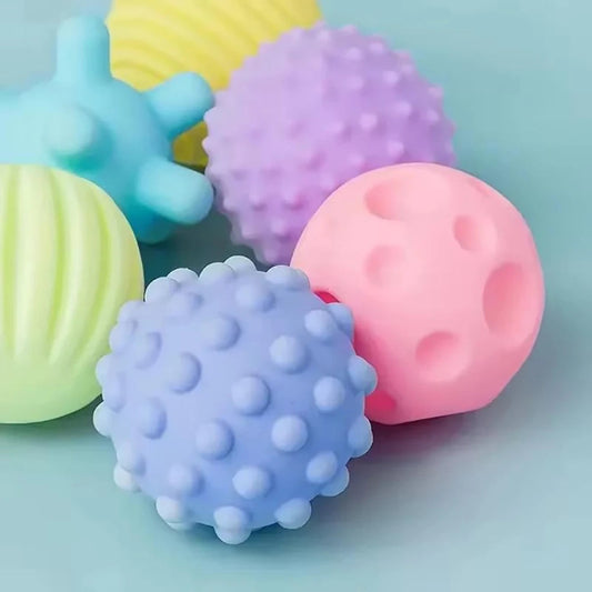 Colorful textured balls on a light blue background