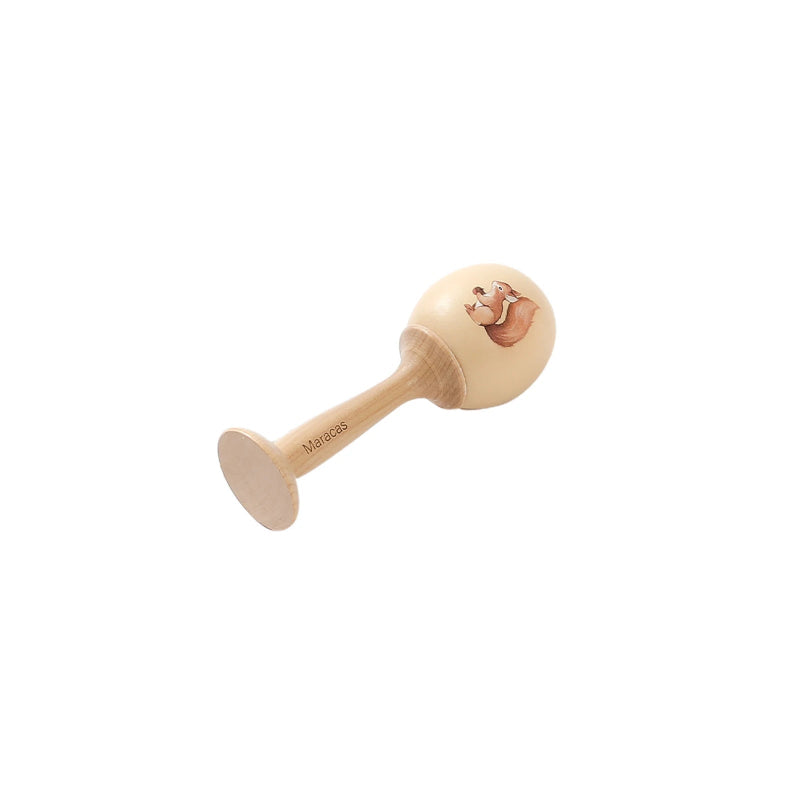 Wooden baby rattle with a smiling face on a white background