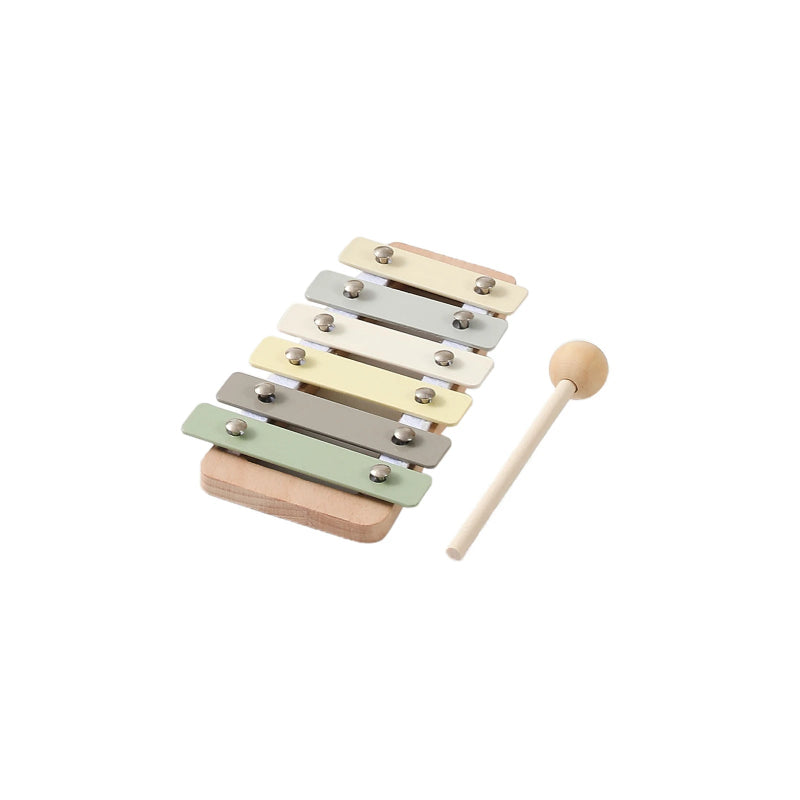 Wooden xylophone with colorful keys and a mallet on a white background