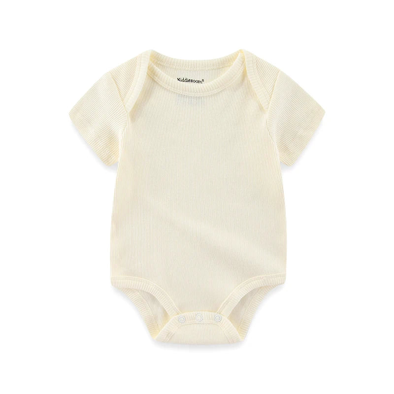Yellow baby onesie on a white background