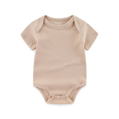 Beige baby bodysuit on a white background