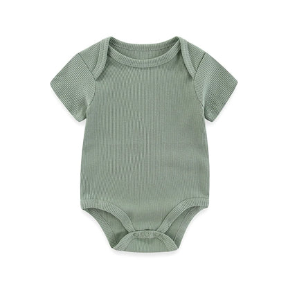 Green baby bodysuit with short sleeves on a white background