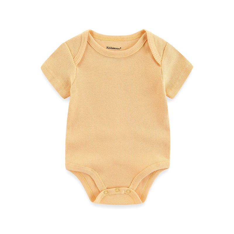 Yellow baby onesie on a white background