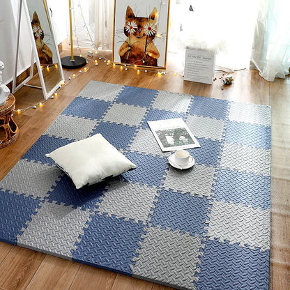 Checkered blue and gray rug on a wooden floor with decorative items.