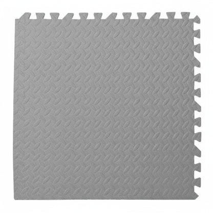 Gray interlocking foam mat with textured pattern on a white background