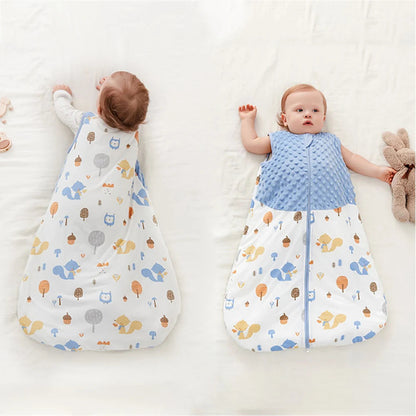 Two babies lying on a white surface, each in a patterned sleeping bag.