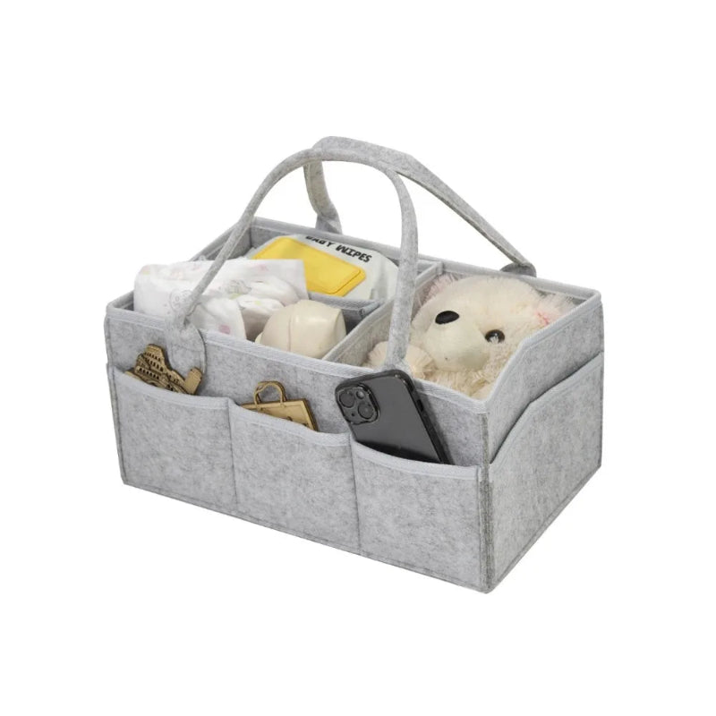 Gray caddy with compartments containing plush toys and a phone on a white background